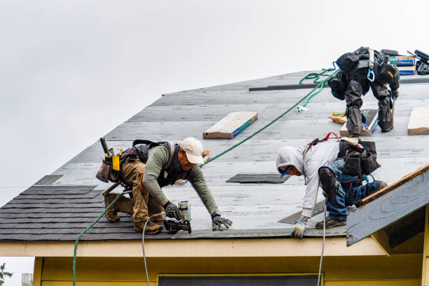 Professional Gutter Installation technician working in Saranac Lake, NY